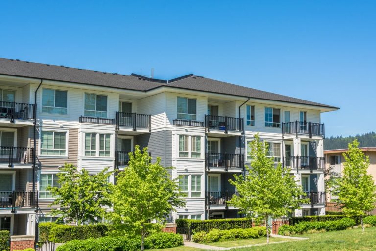 apartment complex with dark asphalt shingle roof in Roseville, Minnesota