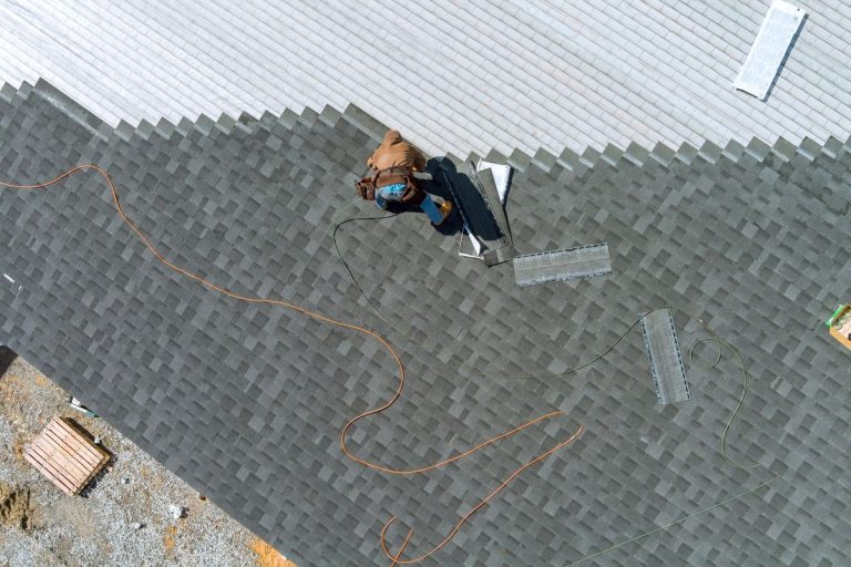roofer installing shingles on a roof, Roseville, MN